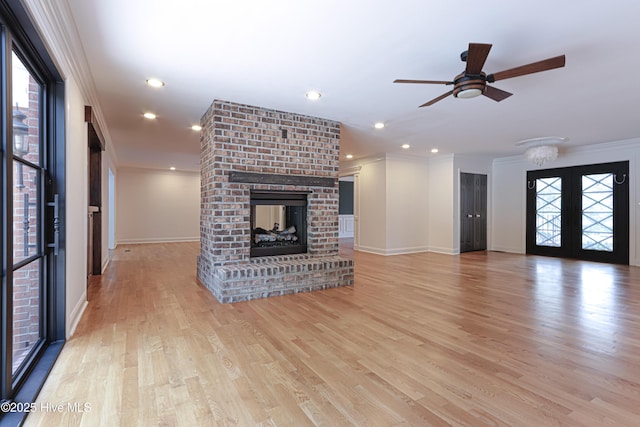 240 Donald Ross Dr, Pinehurst, NC 28374 - unfurnished living room featuring ornamental molding, ceiling fan, baseboards, a fireplace, and light wood finished floors