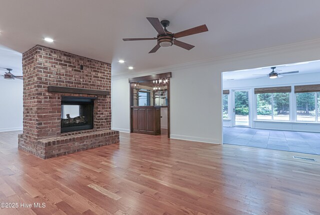 240 Donald Ross Dr, Pinehurst, NC 28374 - unfurnished living room with ceiling fan, crown molding, wood finished floors, and recessed lighting