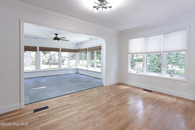 240 Donald Ross Dr, Pinehurst, NC 28374 - spare room featuring baseboards, light wood finished floors, a ceiling fan, and crown molding