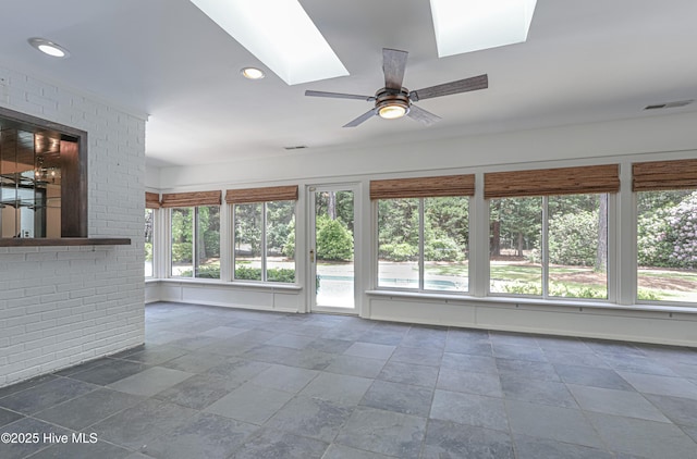 240 Donald Ross Dr, Pinehurst, NC 28374 - unfurnished living room with a skylight, stone tile floors, a ceiling fan, and recessed lighting
