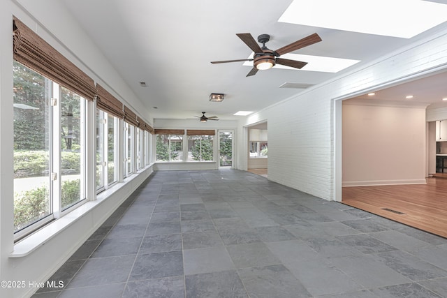 240 Donald Ross Dr, Pinehurst, NC 28374 - unfurnished sunroom with a skylight, baseboards, and crown molding