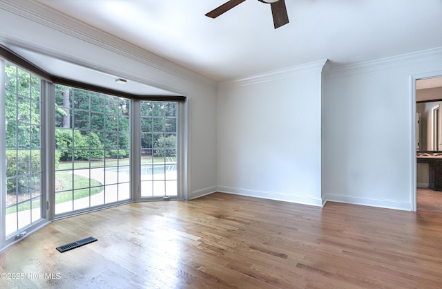240 Donald Ross Dr, Pinehurst, NC 28374 - spare room with ceiling fan, baseboards, crown molding, and wood finished floors