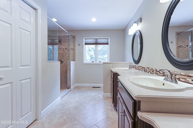 240 Donald Ross Dr, Pinehurst, NC 28374 - full bathroom with a shower stall, baseboards, double vanity, decorative backsplash, and recessed lighting