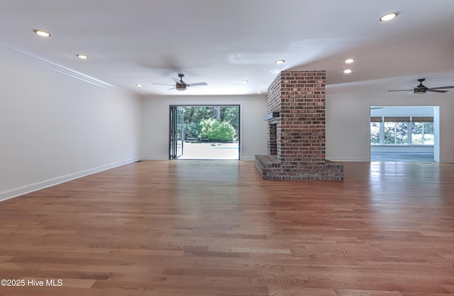 240 Donald Ross Dr, Pinehurst, NC 28374 - unfurnished living room with ceiling fan, baseboards, recessed lighting, wood finished floors, and crown molding