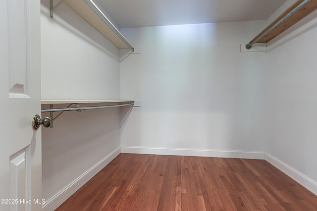 240 Donald Ross Dr, Pinehurst, NC 28374 - walk in closet featuring wood finished floors