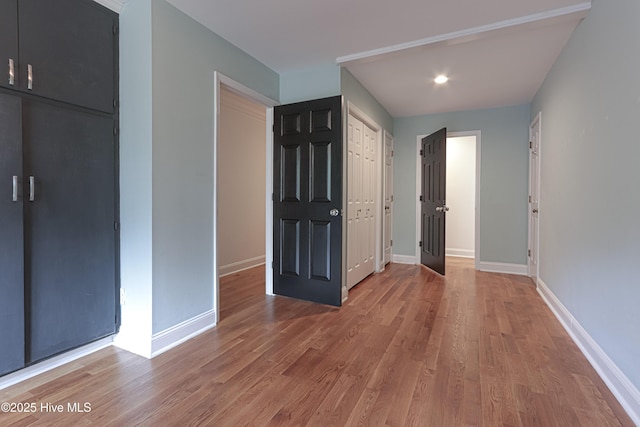 240 Donald Ross Dr, Pinehurst, NC 28374 - unfurnished bedroom with baseboards, light wood-style floors, and recessed lighting