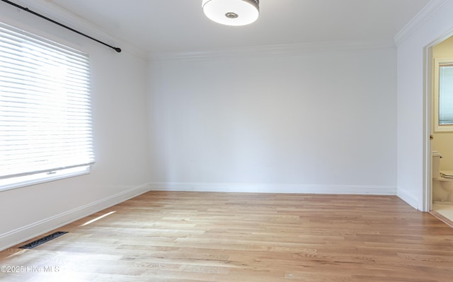 240 Donald Ross Dr, Pinehurst, NC 28374 - empty room featuring ornamental molding, healthy amount of natural light, light wood-type flooring, and baseboards