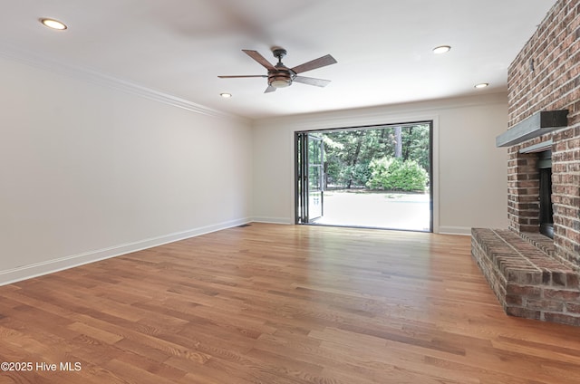 240 Donald Ross Dr, Pinehurst, NC 28374 - unfurnished living room with a ceiling fan, a brick fireplace, ornamental molding, light wood-type flooring, and baseboards