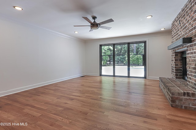 240 Donald Ross Dr, Pinehurst, NC 28374 - unfurnished living room with ornamental molding, a ceiling fan, a fireplace, wood finished floors, and baseboards