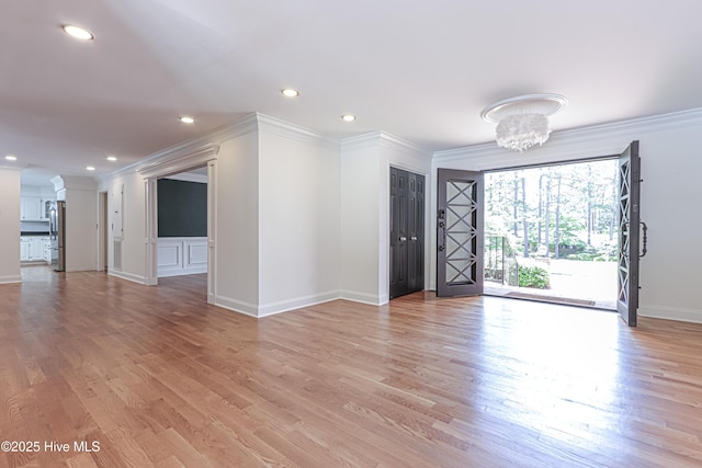 240 Donald Ross Dr, Pinehurst, NC 28374 - empty room with crown molding, light wood-style floors, baseboards, recessed lighting, and a chandelier