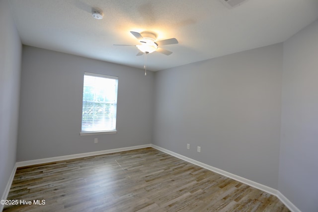 717 Chancery Ln, Aberdeen, NC 28315 - unfurnished room with a ceiling fan, a smoke detector, wood finished floors, and baseboards