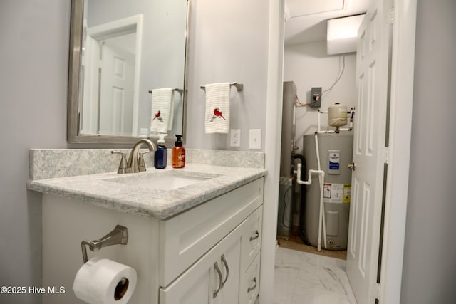717 Chancery Ln, Aberdeen, NC 28315 - bathroom featuring water heater, vanity, and marble finish floors