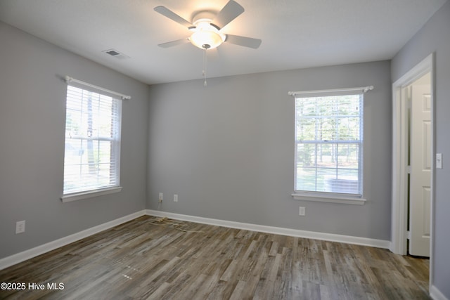 717 Chancery Ln, Aberdeen, NC 28315 - spare room featuring wood finished floors, a ceiling fan, and baseboards