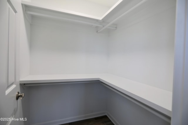 717 Chancery Ln, Aberdeen, NC 28315 - walk in closet featuring dark wood-style floors