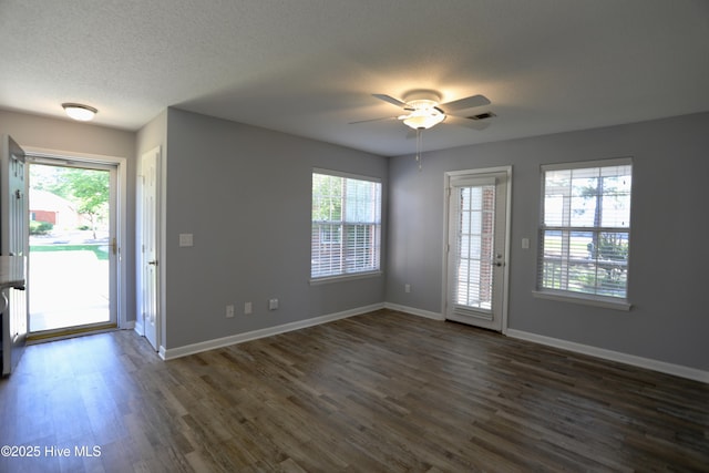 717 Chancery Ln, Aberdeen, NC 28315 - entrance foyer featuring a ceiling fan, dark wood-style flooring, healthy amount of natural light, baseboards, and a textured ceiling