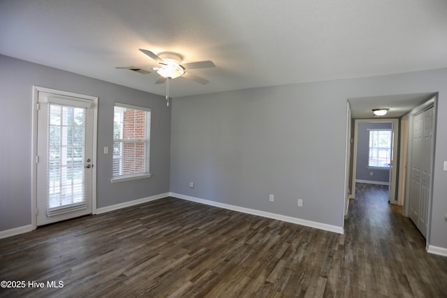 717 Chancery Ln, Aberdeen, NC 28315 - spare room featuring a ceiling fan, dark wood-type flooring, and baseboards