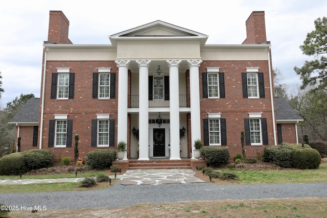 6680 Beulah Hill Church Rd, West End, NC 27376 - greek revival inspired property featuring a chimney, a balcony, and brick siding