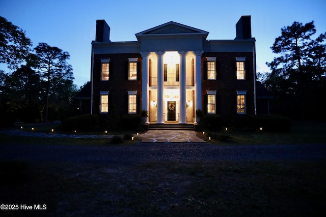 6680 Beulah Hill Church Rd, West End, NC 27376 - view of front facade with a chimney and a balcony