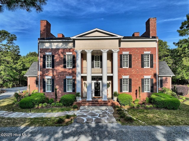 6680 Beulah Hill Church Rd, West End, NC 27376 - neoclassical / greek revival house featuring a balcony, a chimney, and brick siding