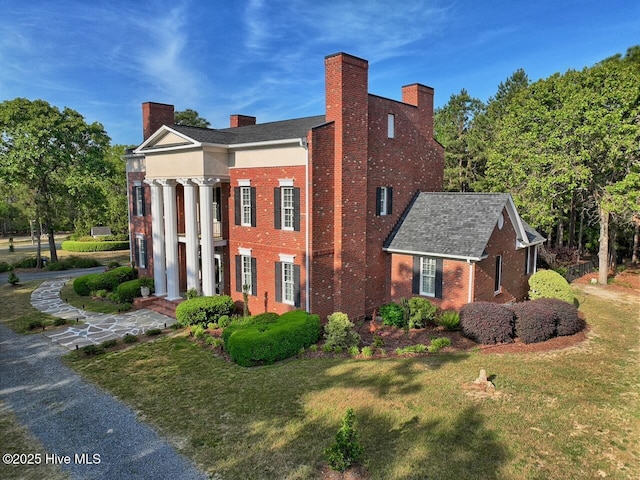 6680 Beulah Hill Church Rd, West End, NC 27376 - view of property exterior featuring brick siding, a lawn, and a chimney