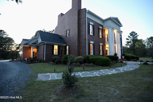 6680 Beulah Hill Church Rd, West End, NC 27376 - view of home's exterior featuring brick siding and a lawn