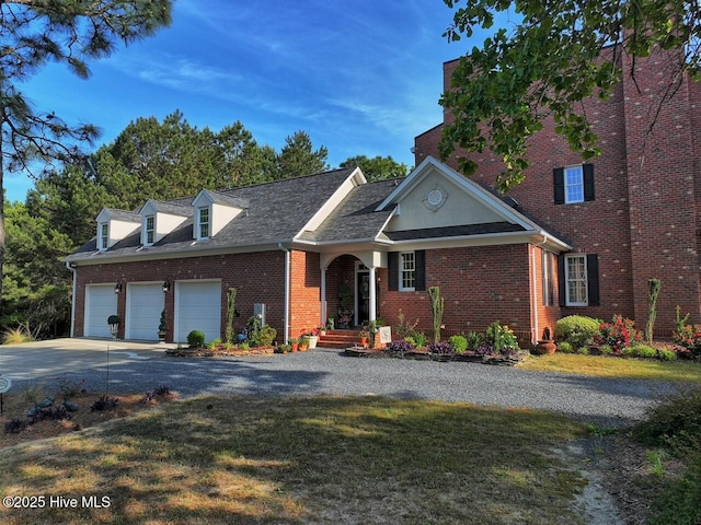 6680 Beulah Hill Church Rd, West End, NC 27376 - view of front of home with driveway, a garage, brick siding, and a front yard