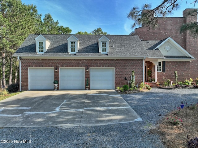 6680 Beulah Hill Church Rd, West End, NC 27376 - view of front of home with driveway, brick siding, roof with shingles, and a garage