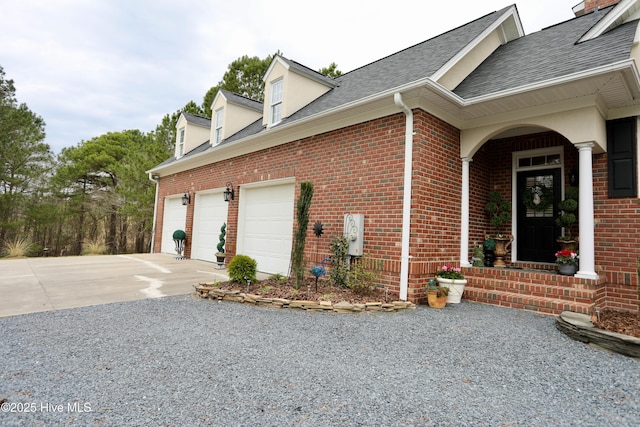 6680 Beulah Hill Church Rd, West End, NC 27376 - view of side of home with concrete driveway, a garage, brick siding, and a shingled roof