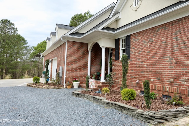6680 Beulah Hill Church Rd, West End, NC 27376 - view of home's exterior featuring crawl space, driveway, brick siding, and a chimney