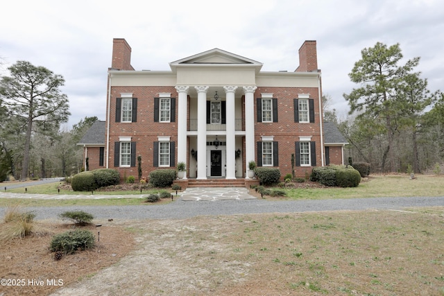 6680 Beulah Hill Church Rd, West End, NC 27376 - greek revival inspired property with a chimney, brick siding, and a balcony