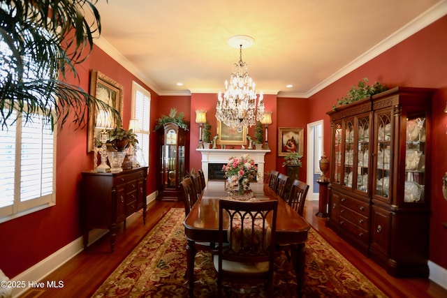 6680 Beulah Hill Church Rd, West End, NC 27376 - dining area featuring wood finished floors, a chandelier, ornamental molding, a fireplace, and recessed lighting