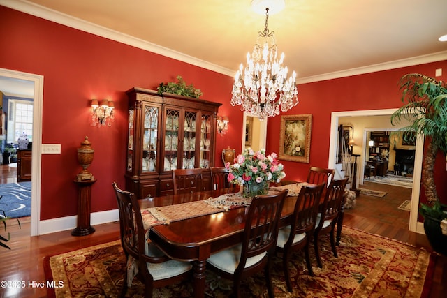 6680 Beulah Hill Church Rd, West End, NC 27376 - dining area featuring wood finished floors, ornamental molding, and a chandelier