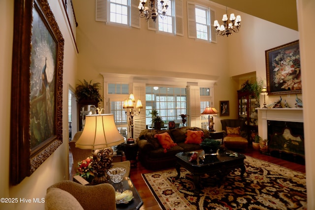 6680 Beulah Hill Church Rd, West End, NC 27376 - living room with a chandelier, wood finished floors, and a high ceiling