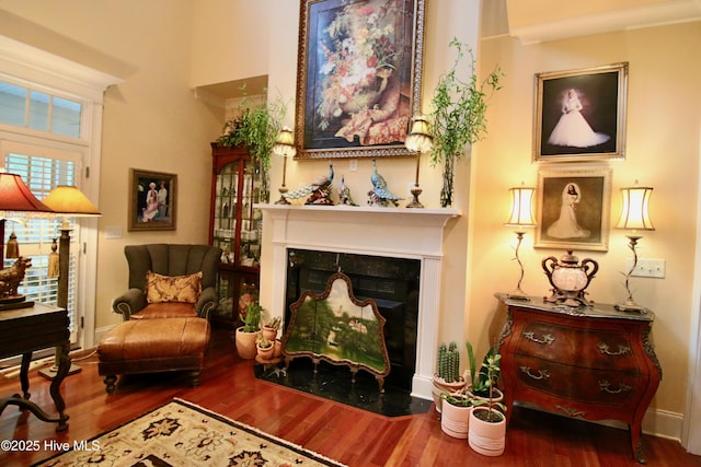 6680 Beulah Hill Church Rd, West End, NC 27376 - living area featuring wood finished floors, a fireplace with flush hearth, and a towering ceiling