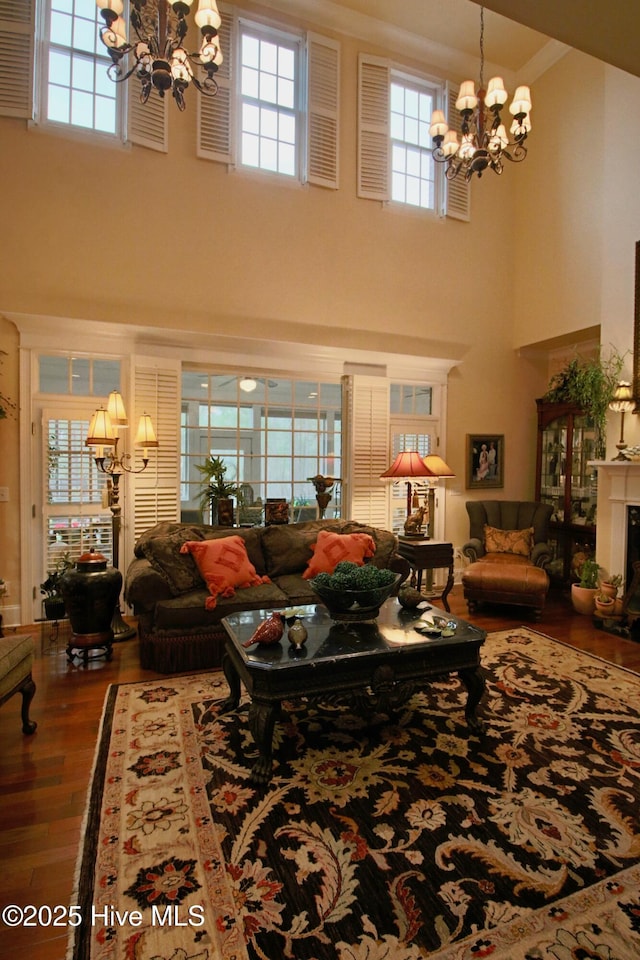 6680 Beulah Hill Church Rd, West End, NC 27376 - living room with a chandelier, a towering ceiling, and wood finished floors