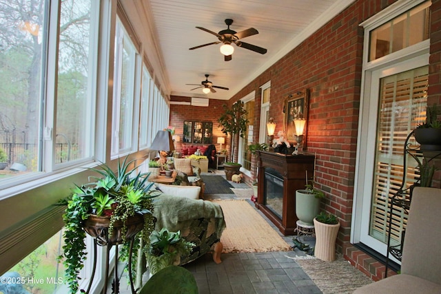 6680 Beulah Hill Church Rd, West End, NC 27376 - sunroom / solarium with brick floors, brick wall, and ornamental molding