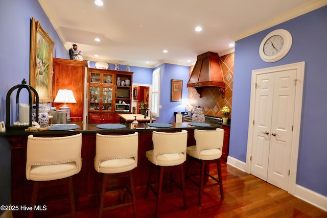 6680 Beulah Hill Church Rd, West End, NC 27376 - indoor bar with premium range hood, stainless steel microwave, ornamental molding, backsplash, and dark wood finished floors