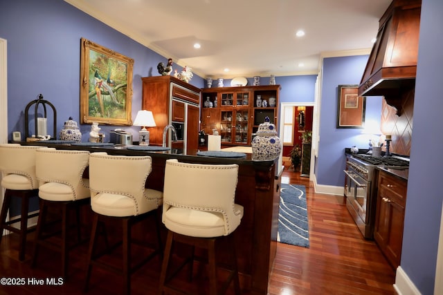 6680 Beulah Hill Church Rd, West End, NC 27376 - bar featuring range with two ovens, tasteful backsplash, dark wood-style floors, recessed lighting, and crown molding