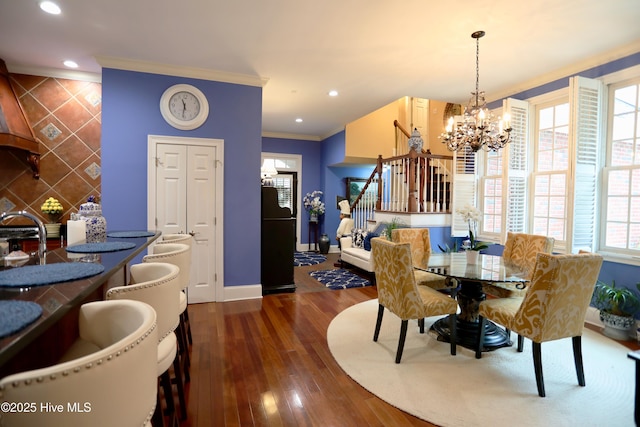 6680 Beulah Hill Church Rd, West End, NC 27376 - dining space with stairs, a chandelier, plenty of natural light, hardwood / wood-style floors, and crown molding
