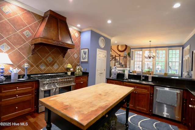 6680 Beulah Hill Church Rd, West End, NC 27376 - kitchen with appliances with stainless steel finishes, custom exhaust hood, butcher block countertops, tasteful backsplash, and a chandelier