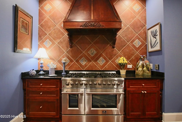 6680 Beulah Hill Church Rd, West End, NC 27376 - kitchen with range with two ovens, premium range hood, reddish brown cabinets, and decorative backsplash