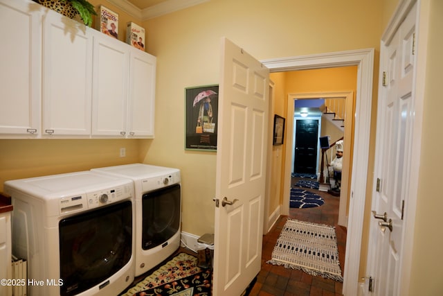 6680 Beulah Hill Church Rd, West End, NC 27376 - laundry area featuring washer and clothes dryer, cabinet space, brick floors, and ornamental molding