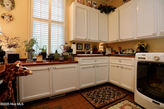 6680 Beulah Hill Church Rd, West End, NC 27376 - laundry area with washer / clothes dryer and cabinet space
