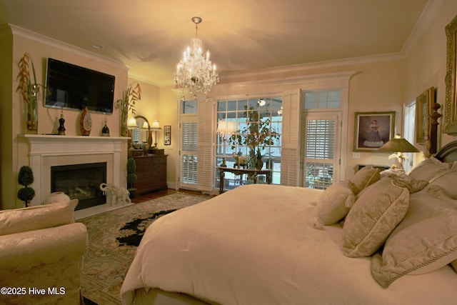 6680 Beulah Hill Church Rd, West End, NC 27376 - bedroom with a chandelier, crown molding, a fireplace with flush hearth, and wood finished floors