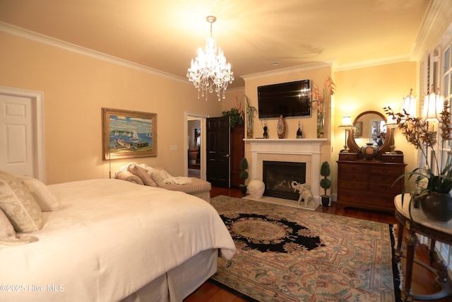 6680 Beulah Hill Church Rd, West End, NC 27376 - bedroom with crown molding, wood finished floors, a fireplace with flush hearth, and a chandelier
