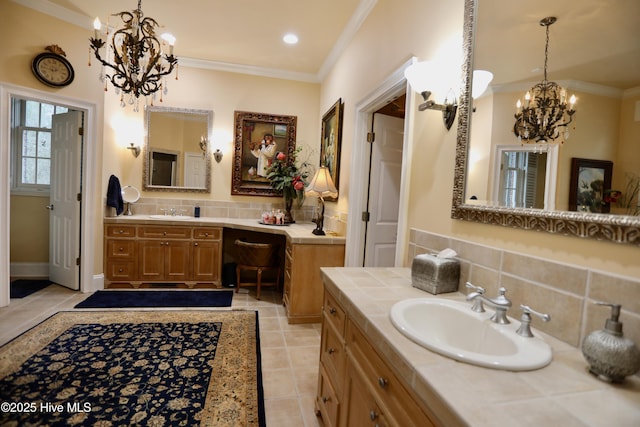 6680 Beulah Hill Church Rd, West End, NC 27376 - bathroom featuring a chandelier, tasteful backsplash, crown molding, two vanities, and tile patterned floors