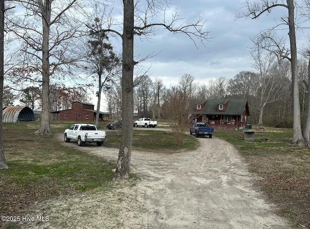 view of street featuring dirt driveway