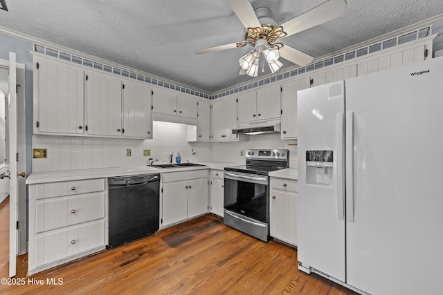 kitchen featuring under cabinet range hood, stainless steel electric stove, black dishwasher, white fridge with ice dispenser, and a sink