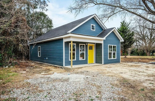 view of front of house featuring a porch and a shingled roof