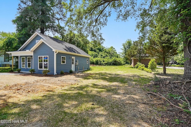 view of property exterior with a yard